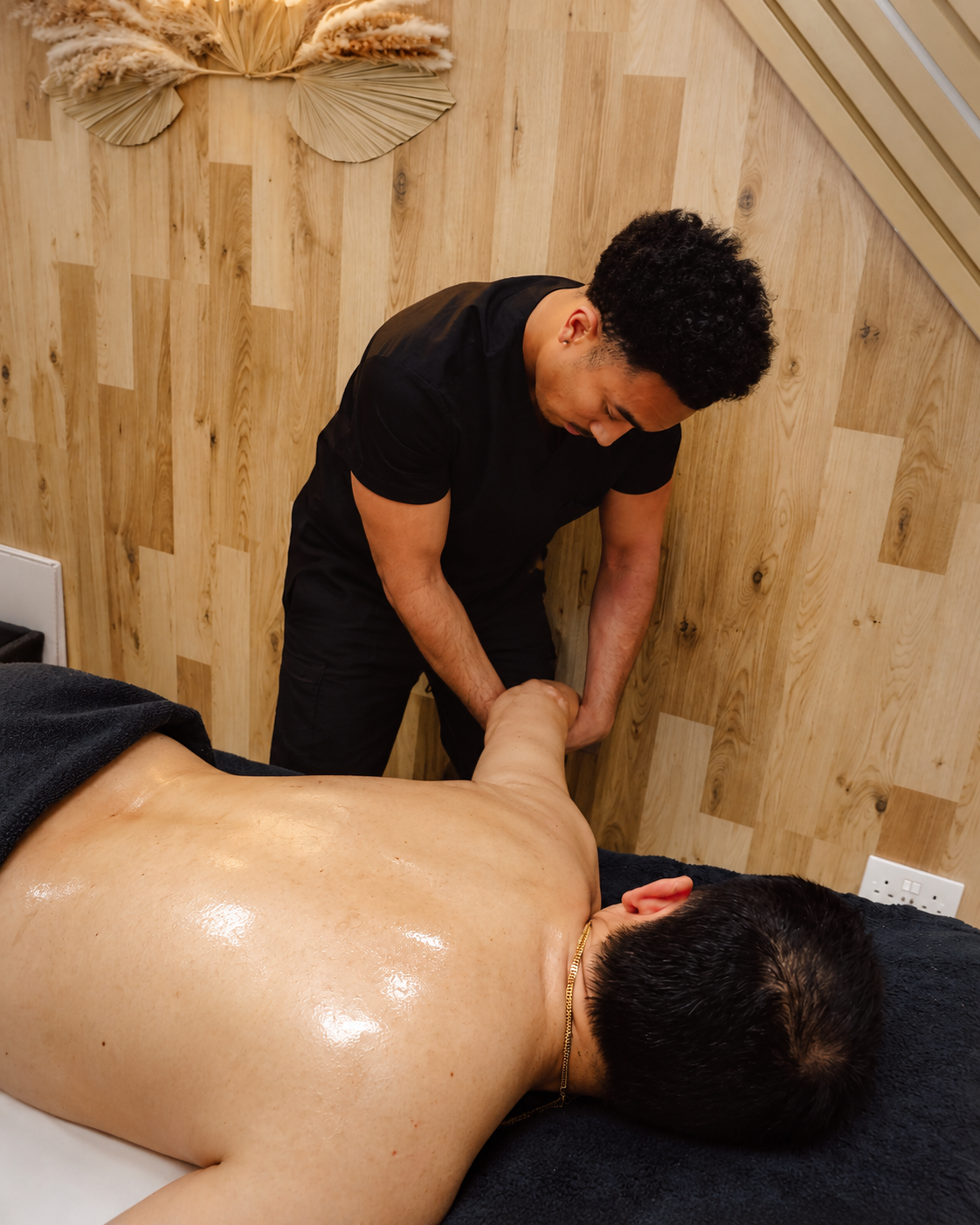 Wesley providing sports massage treatment